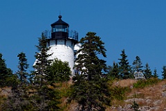 Bear Island Lighthouse Over Rocky Cliffs in Maine